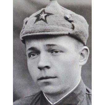 Red Army soldier with badges and Budyonovka hat. Espenlaub militaria