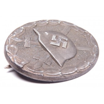Badge met zilveren wond in Zink. Espenlaub militaria