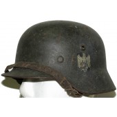 WW2 Duitse Wehrmacht M40 helm, enkele sticker. Maat SE 64