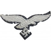 Águila de pecho de la Luftwaffe sobre base de fieltro, sin usar