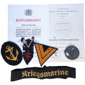 Sarja merkkejä, palkintoja, papereita, jotka kuuluivat Saksan laivaston sotilaalle.