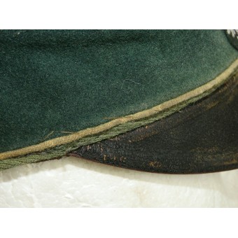 Cappello con visiera della Wehrmacht salata con tracce di un pesante utilizzo in prima linea. Espenlaub militaria