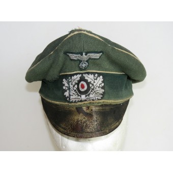 Cappello con visiera della Wehrmacht salata con tracce di un pesante utilizzo in prima linea. Espenlaub militaria