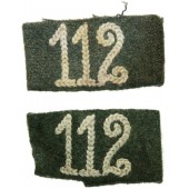 Wehrmachtin 112 jalkaväkirykmentin olkalaudoille kiinnitettävät välilehdet.
