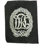 Distintivo sportivo DRL, colore argento. Versione tessuta su rayon nero