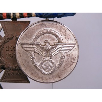 Eine Medaillenleiste mit 3 Auszeichnungen für einen Veteranen des Ersten Weltkriegs, einen Polizeibeamten im 3.. Espenlaub militaria