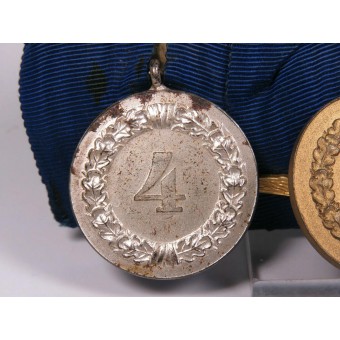 Wehrmacht-medaljstång. 4 och 12 år. Tjänstemedaljer och minneskors från första världskriget.. Espenlaub militaria