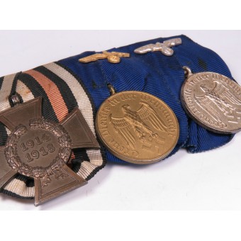 Wehrmacht Medaille Bar. 4 und 12 J. Dienstmedaillen und WW1-Gedenkkreuz. Espenlaub militaria