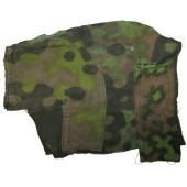 Frammento di uniforme mimetica delle Waffen-SS con riparazioni sul campo