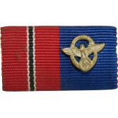 La Compañía del Este y la barra de la cinta de las medallas de largo servicio en la policía del Reich.