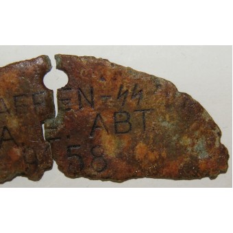 Part of the dog tag SS-Na E ABT. Espenlaub militaria