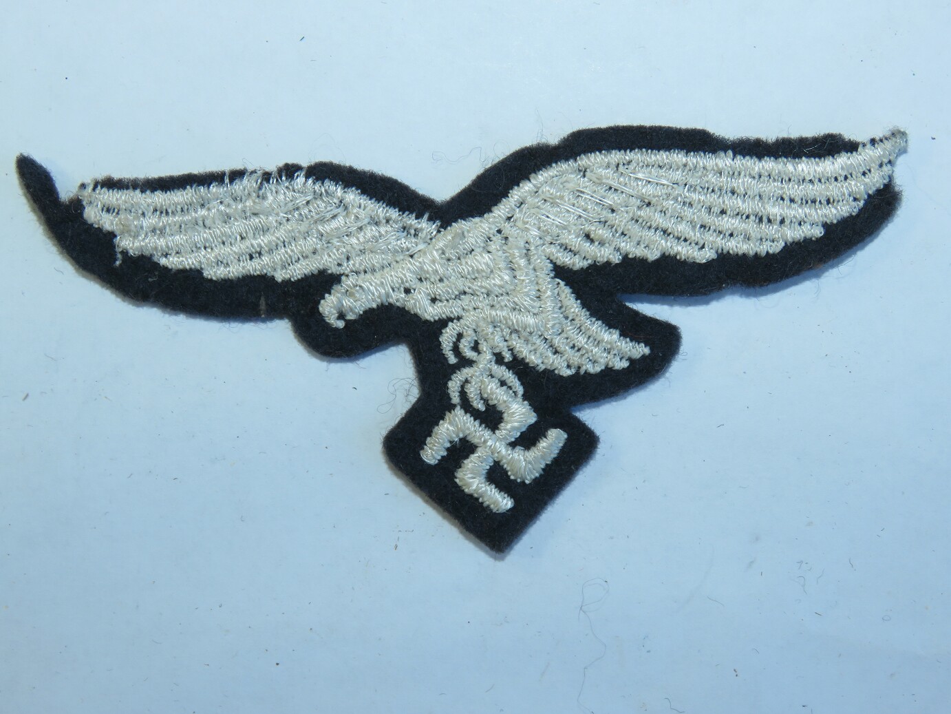 Luftwaffe eagle on the felt base, moth damage